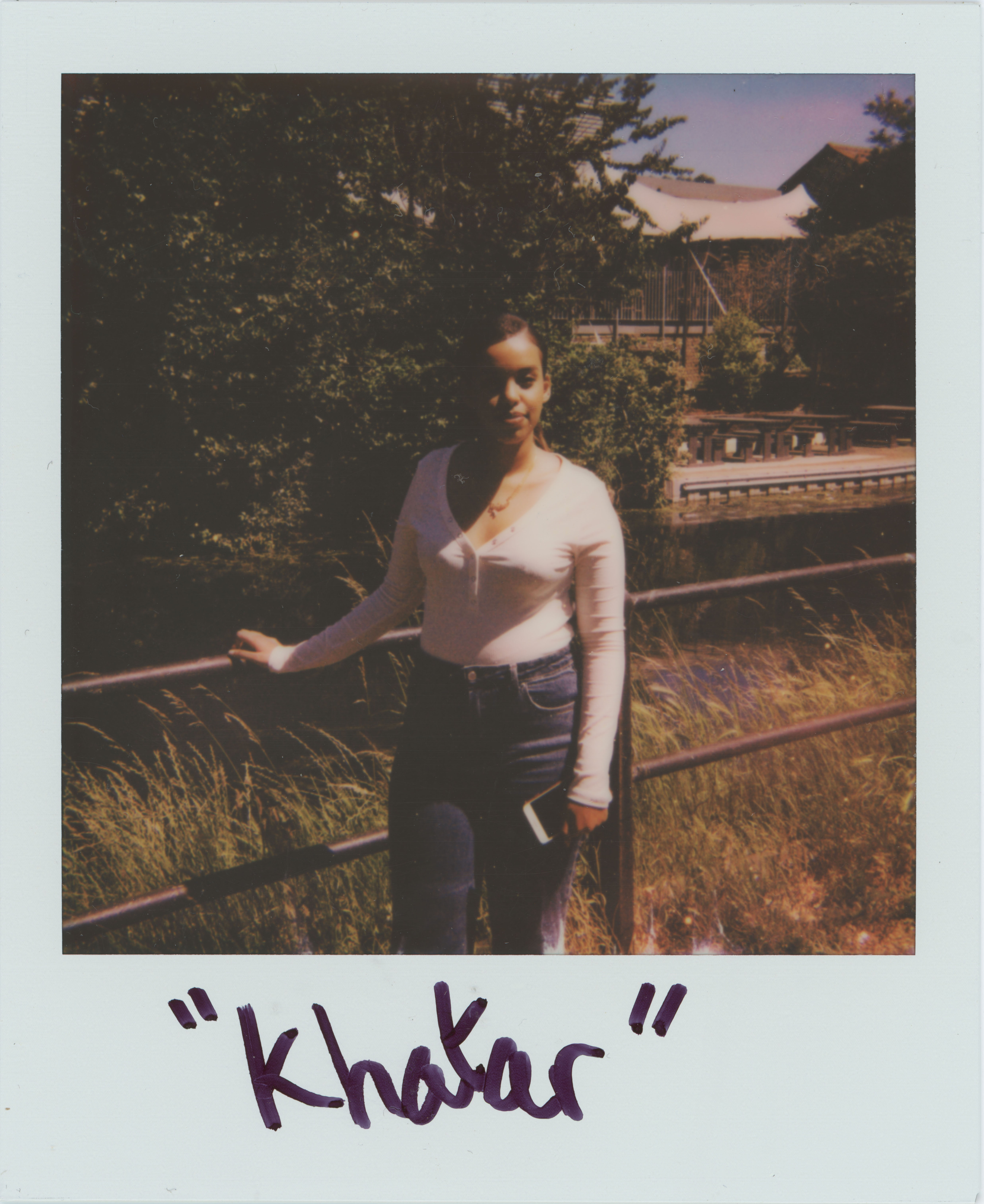 woman standing in front of fence